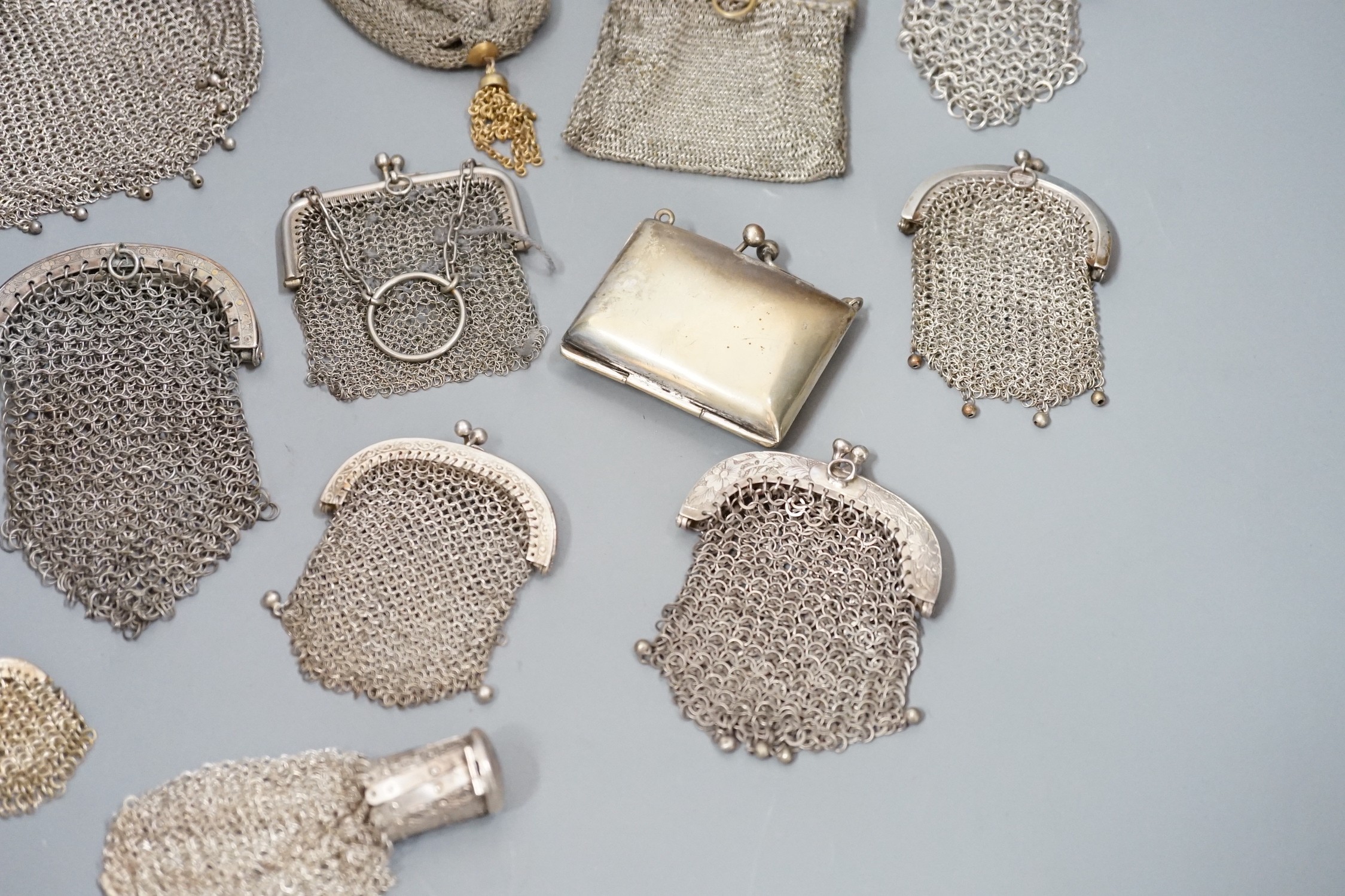 A stamped silver purse, together with eighteen metal chain mail purses and evening bags of various size, thickness and design